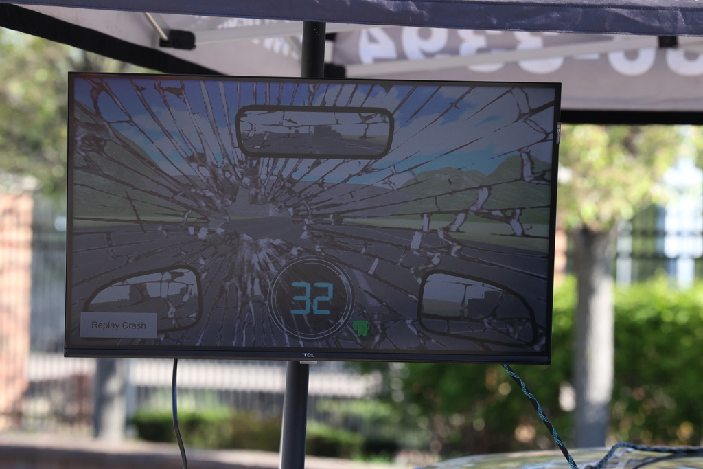 television screen shows cracked windshield and speed limit of 32 