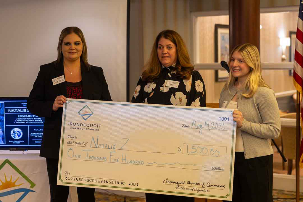 Natalie with Chamber members and scholarship award