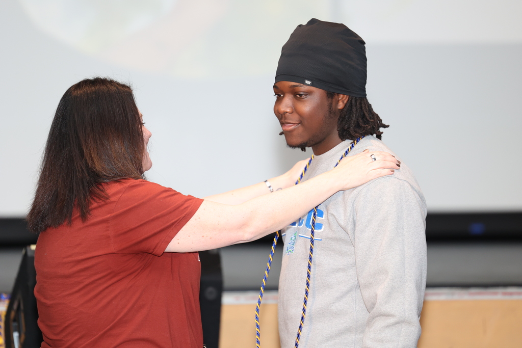 students receives cord during  ceremony