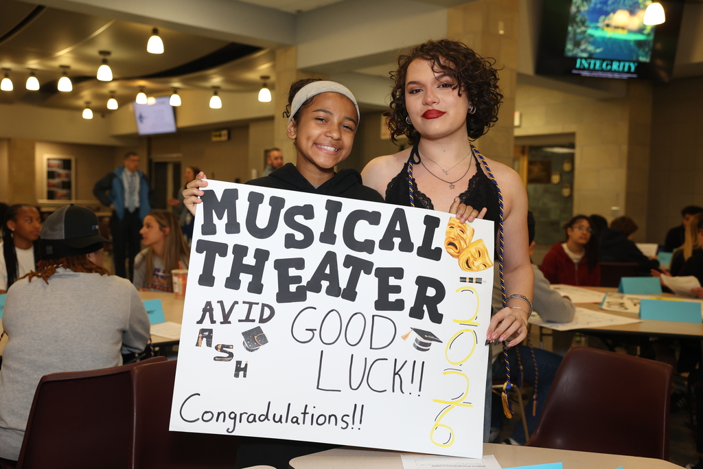students pose for a photo in front of Musical Theater good Luck AVID Ash, Congradulations 2026