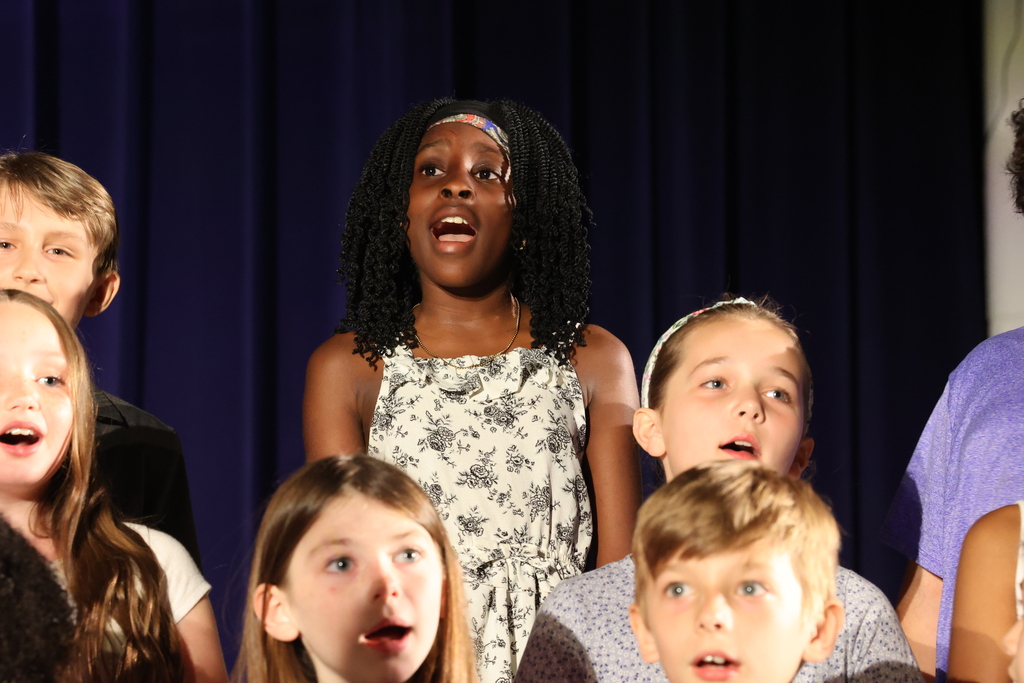 students sings in a chorus