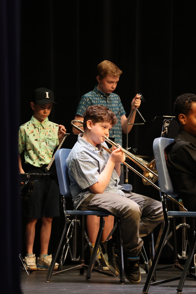 students play instruments in band during a concert