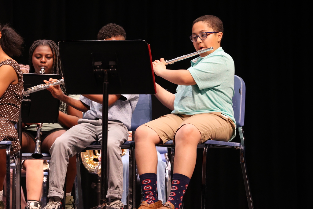student plays the flute