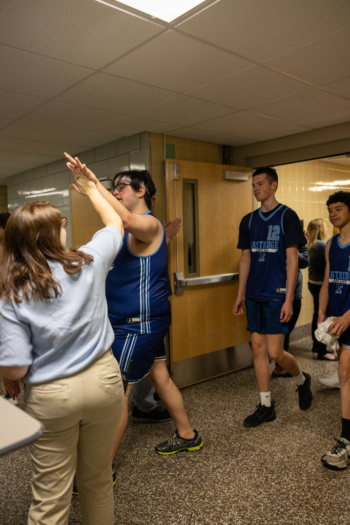 Unified Basketball Players walking through the halls