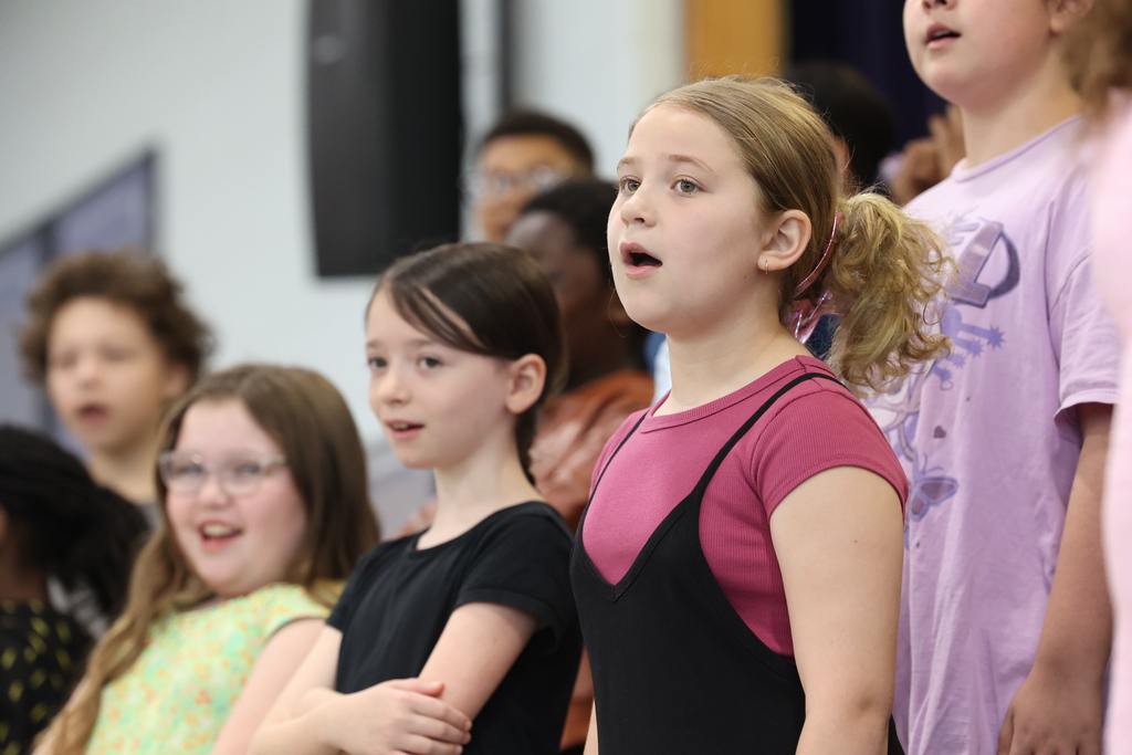 Students sings during chorus performance