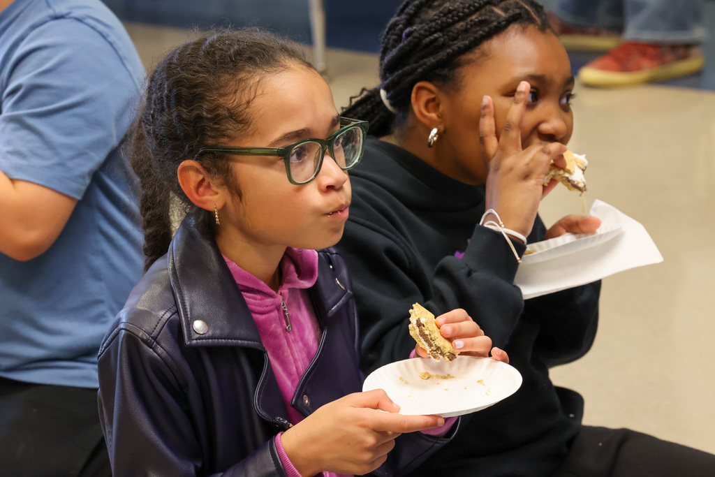 Two girls enjoy smore snack