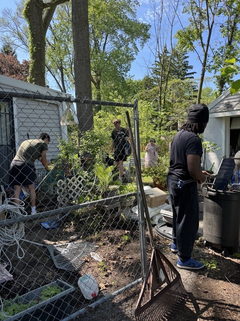 Key Club cleaning up a yard
