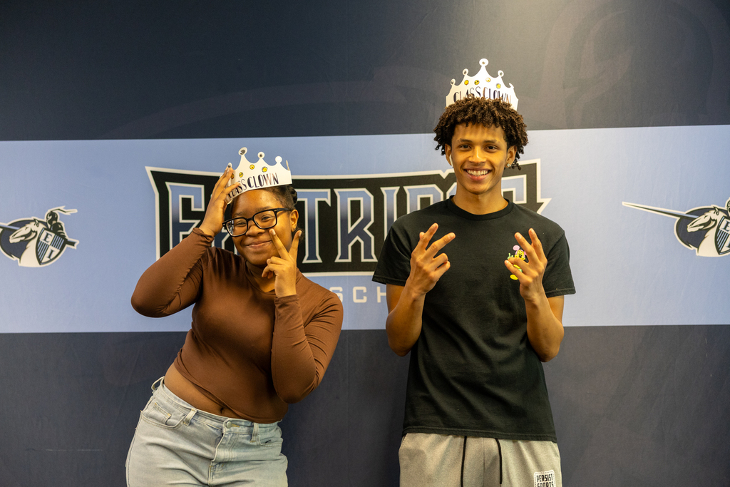 seniors posing with their crowns
