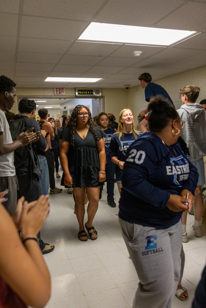 Softball Team walking through the halls being cheered on by staff and students