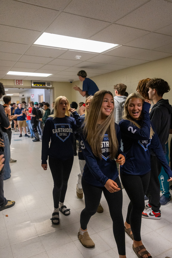 Softball Team walking through the halls being cheered on by staff and students