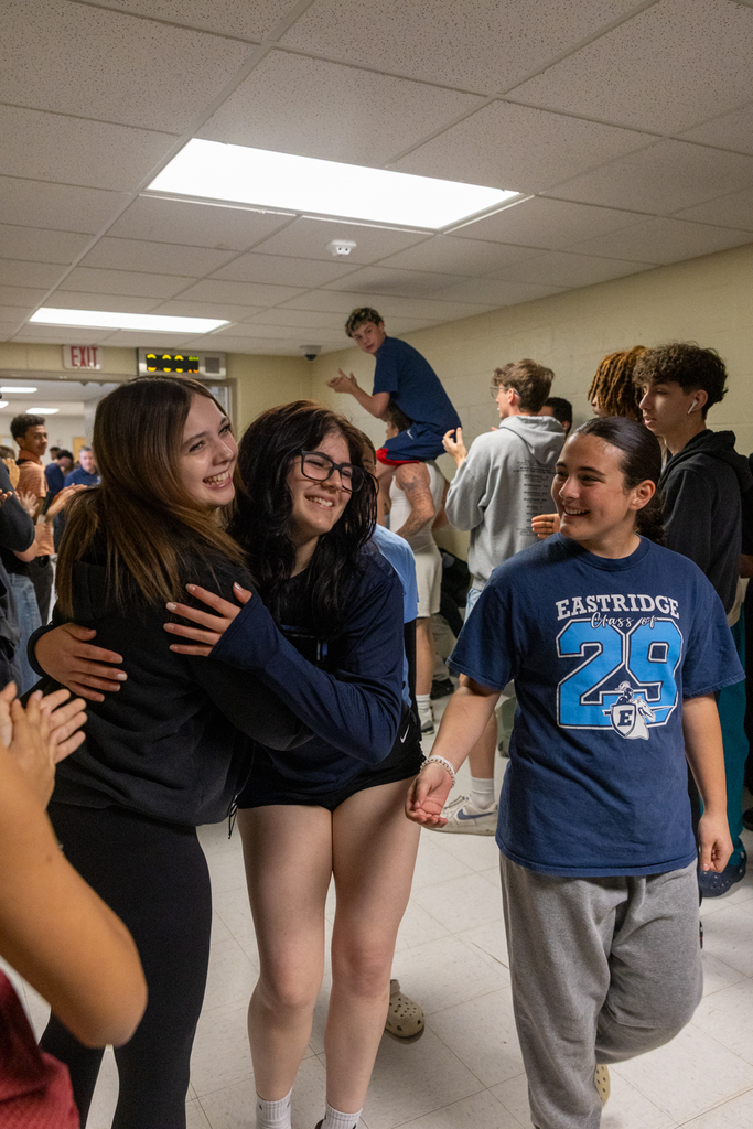 Softball Team walking through the halls being cheered on by staff and students