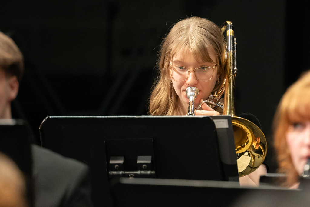student playing trombone
