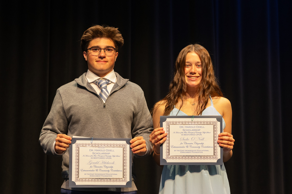 Scholarship winners posing with their certificate