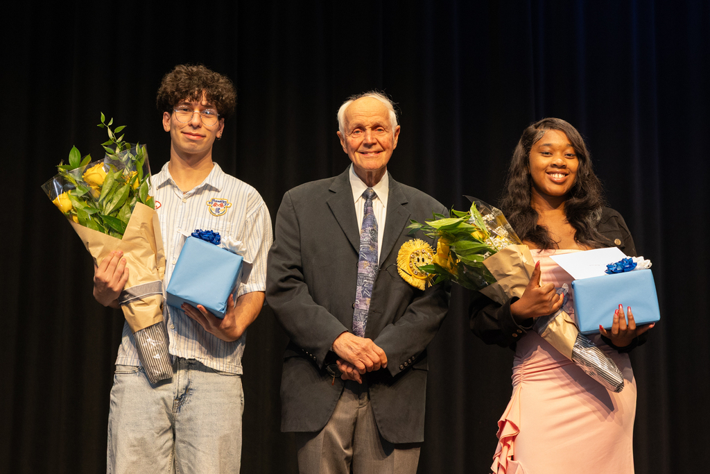 Scholarship winners posing with their certificate