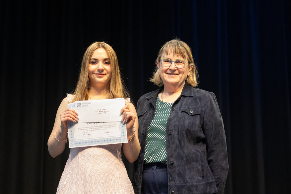 Scholarship winners posing with their certificate