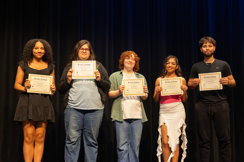 Scholarship winners posing with their certificate