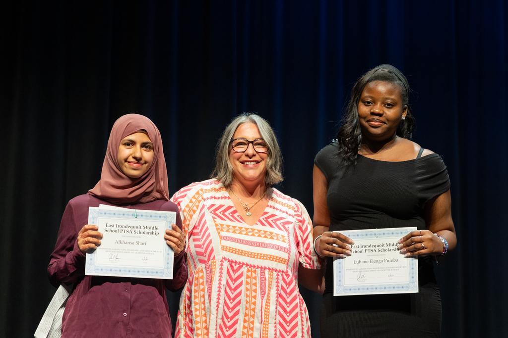 Scholarship winners posing with their certificate