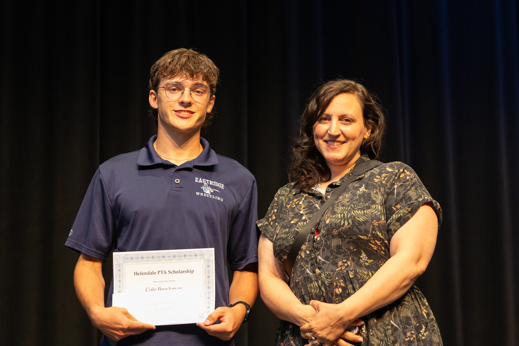 Scholarship winners posing with their certificate