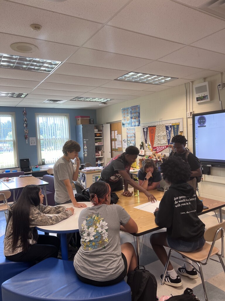 student committee working together to come up with ideas