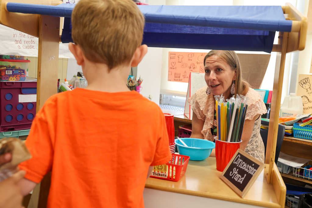 student orders a snowcone from teacher 
