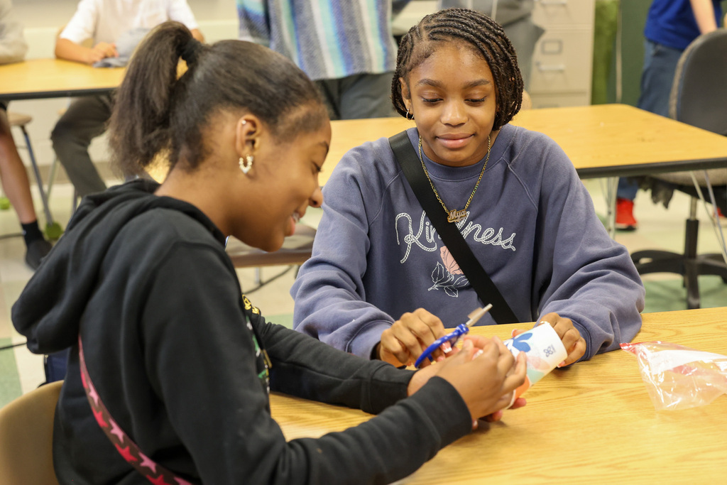 students work on egg holder