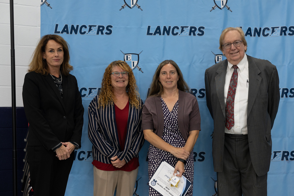 Newly tenured staff with board president and vice president and the superintendent