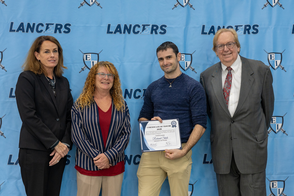 Newly tenured staff with board president and vice president and the superintendent