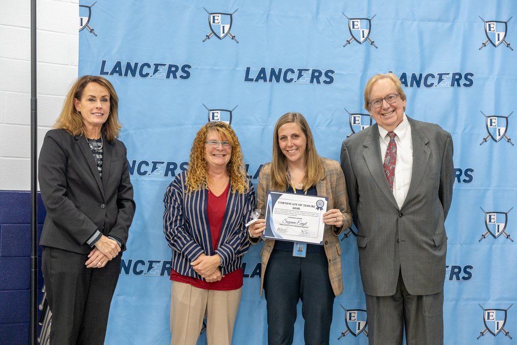 Newly tenured staff with board president and vice president and the superintendent
