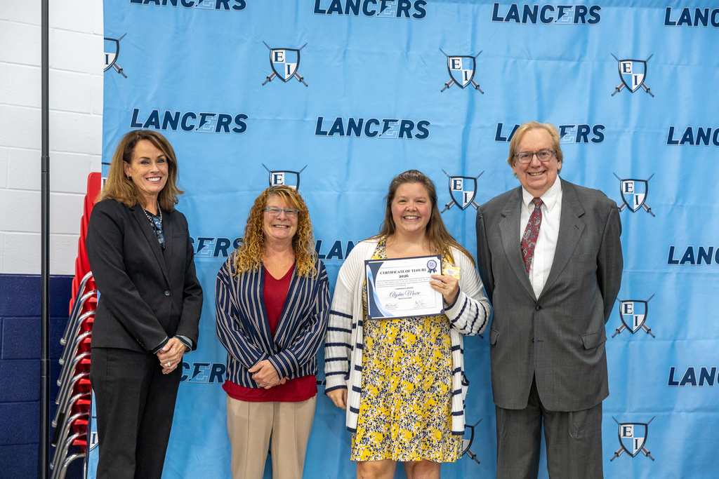 Newly tenured staff with board president and vice president and the superintendent