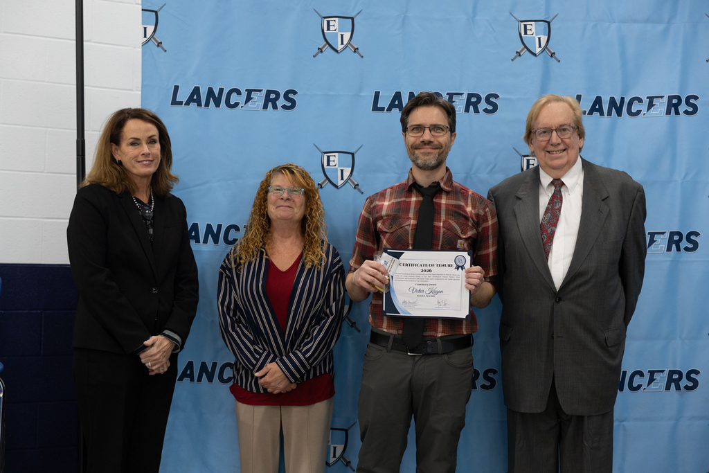 Newly tenured staff with board president and vice president and the superintendent