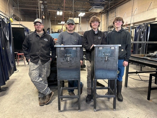 Welding Class displaying their flag boxes.