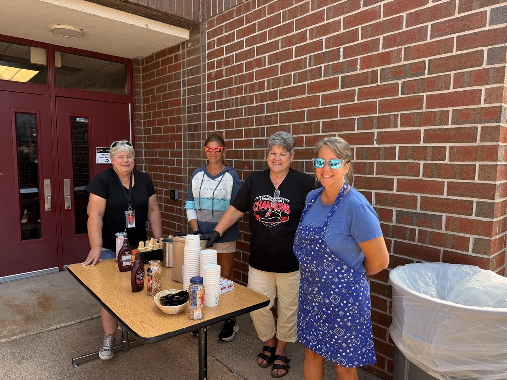 Tracy Zipp, Shannon Hart, Jan Swanson, and Melissa Lyons serving up smiles -- AND ice cream!