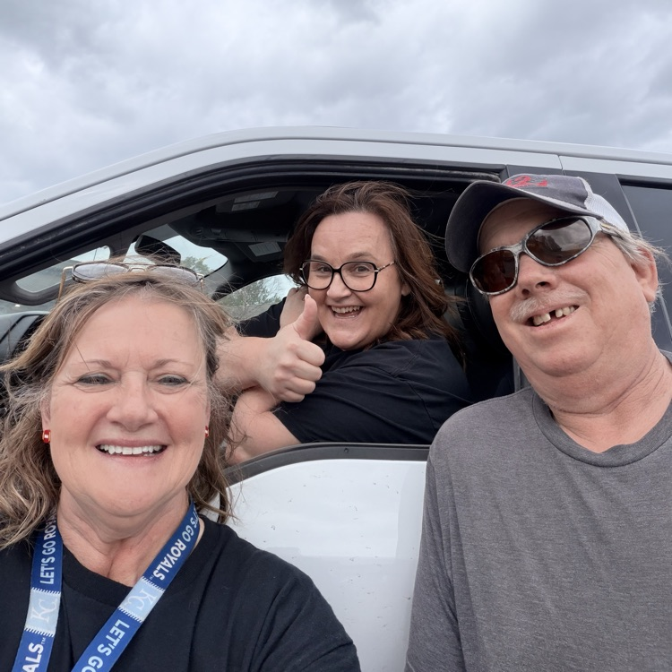 three people thumbs up 