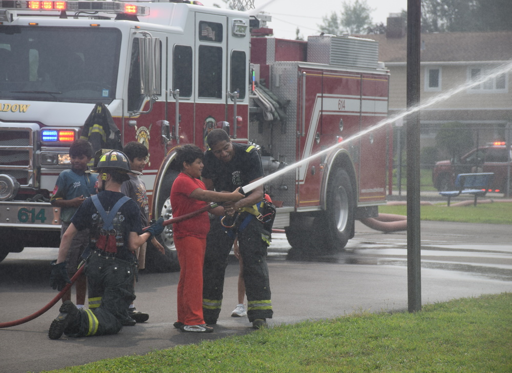 students with firefighters