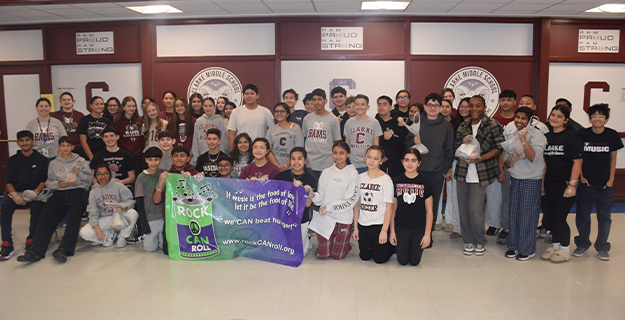 W.T. Clarke students pack hundreds of Meals to support families