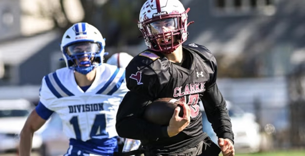 Two students from opposing high schools playing football.