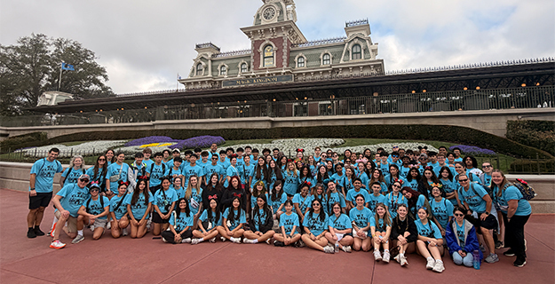 Students standing outside building.
