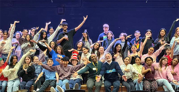Students performing on stage.