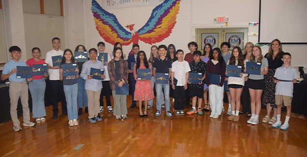 Students holding awards.