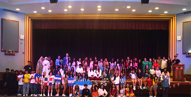 Group photo of students on stage.
