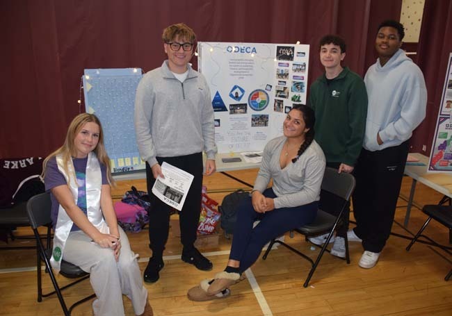 Students gathered in front of their project.