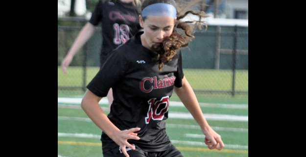 Student playing soccer.
