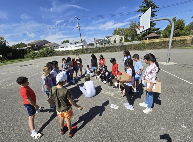5th Graders investigating shadows