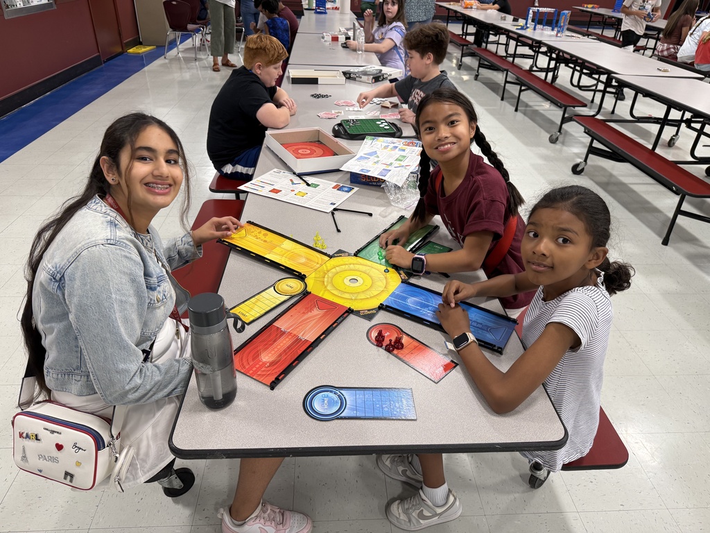 Students playing board game
