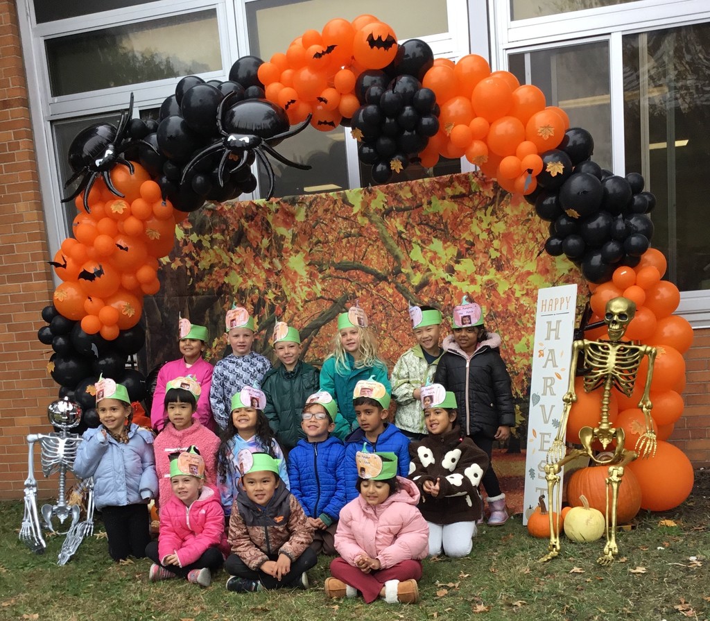McVey students picking pumpkins in front of the school.