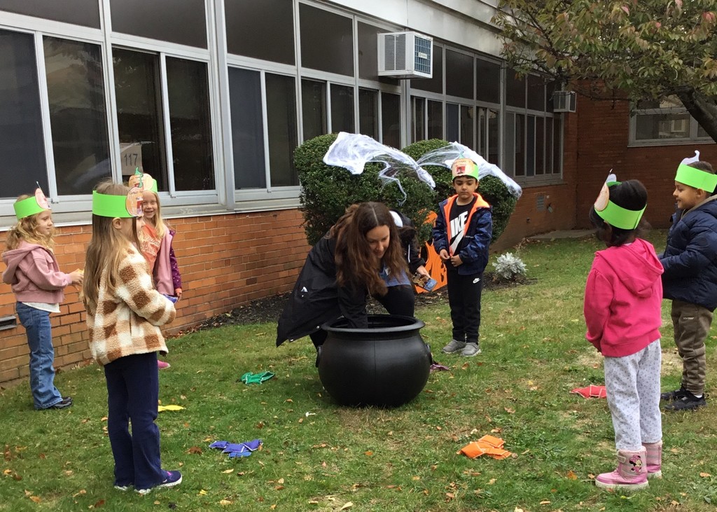 McVey students picking pumpkins in front of the school.