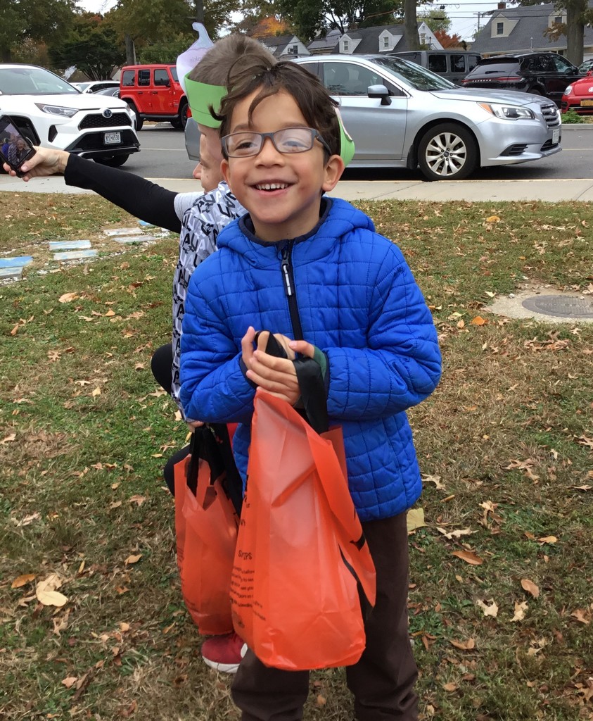 McVey students picking pumpkins in front of the school.