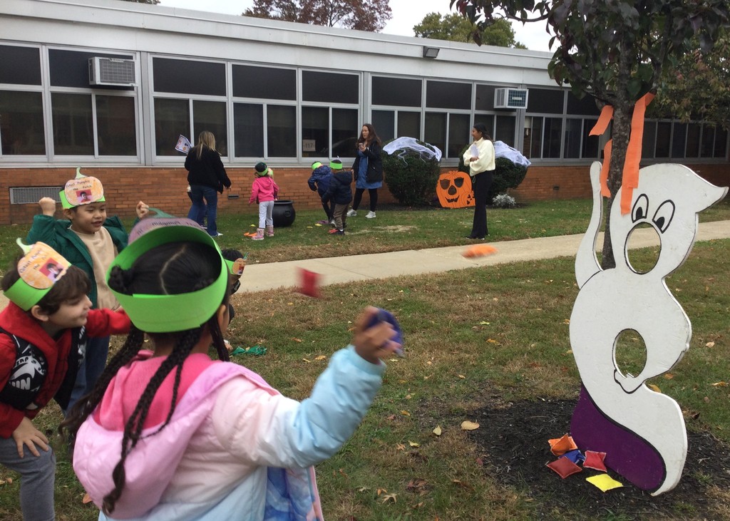 McVey students picking pumpkins in front of the school.