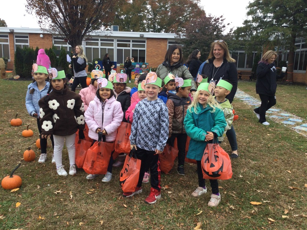 McVey students picking pumpkins in front of the school.