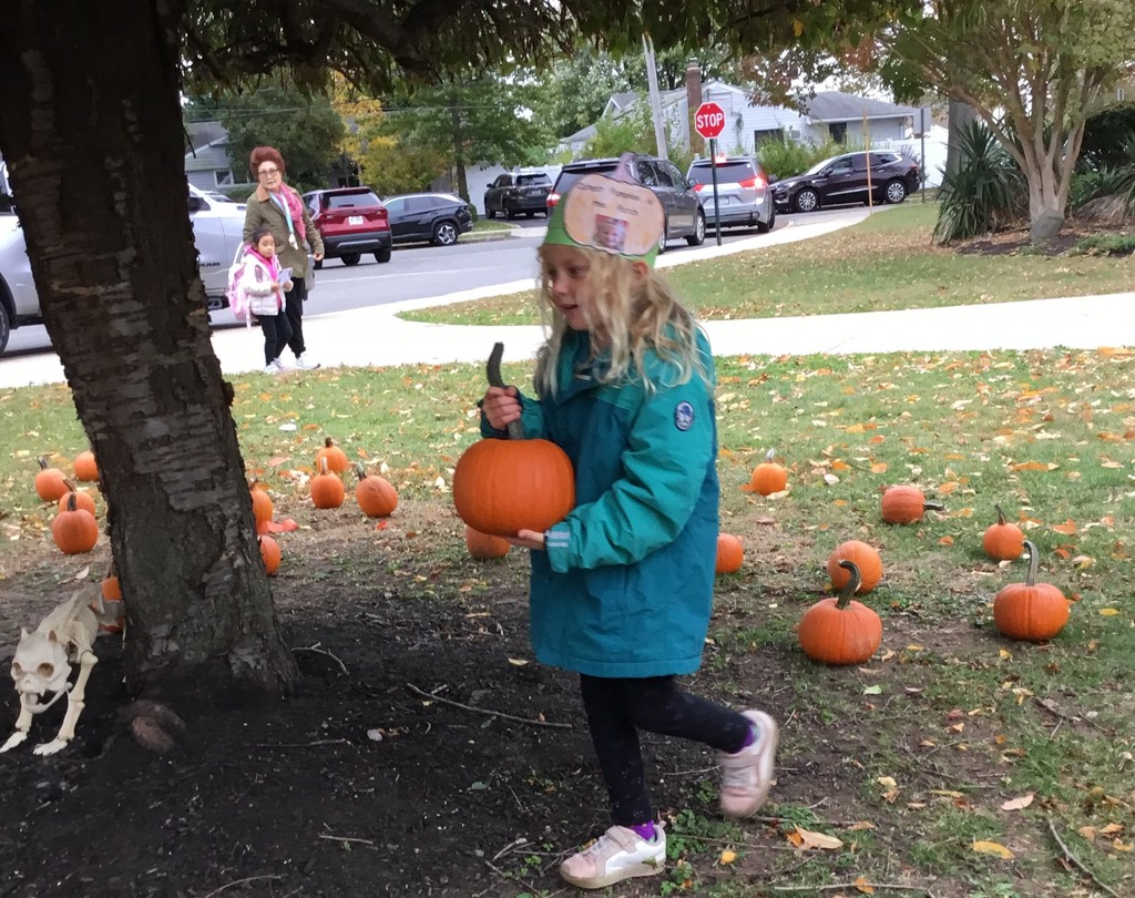 McVey students picking pumpkins in front of the school.